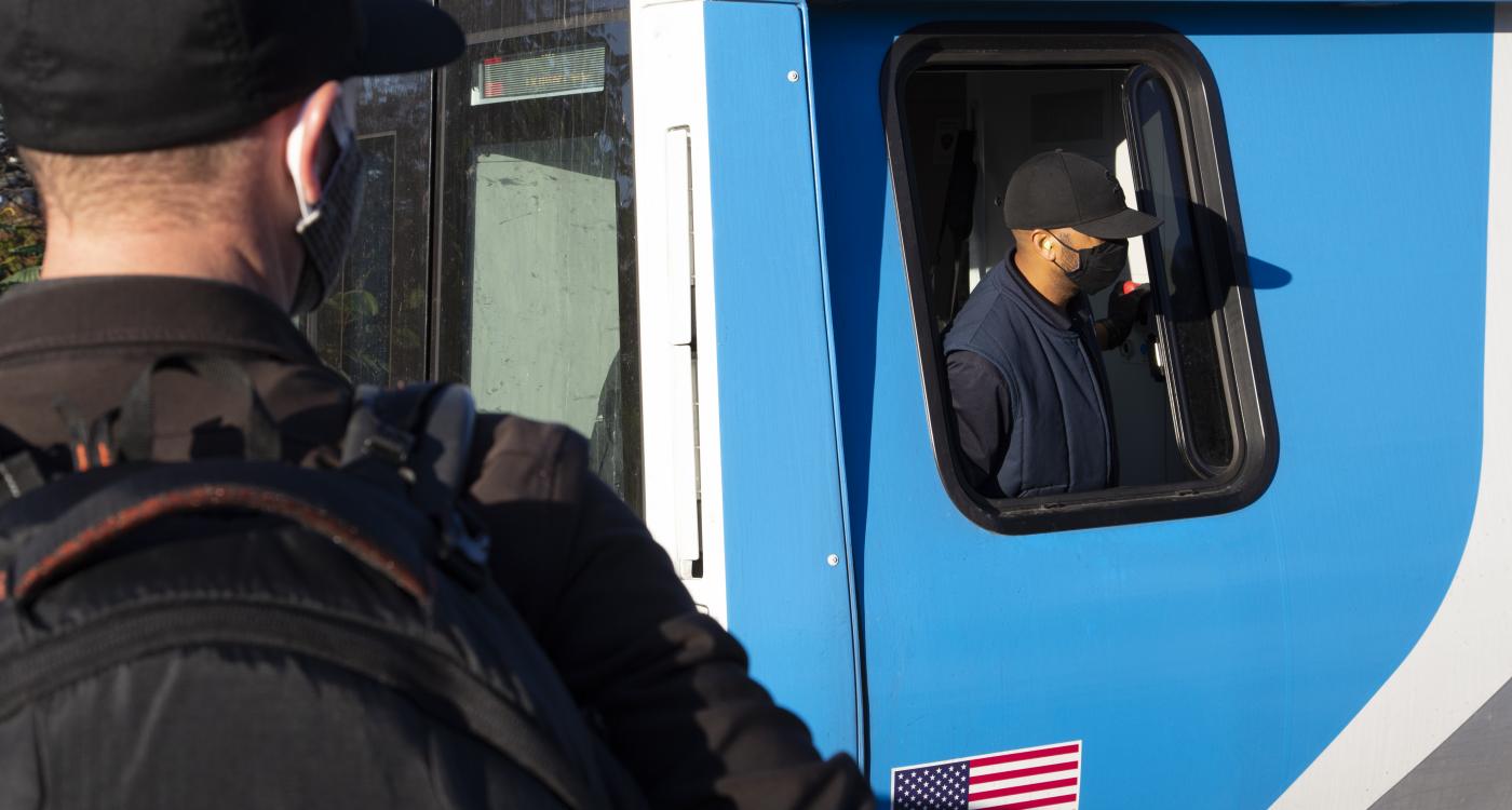 Conductor pulling train into station
